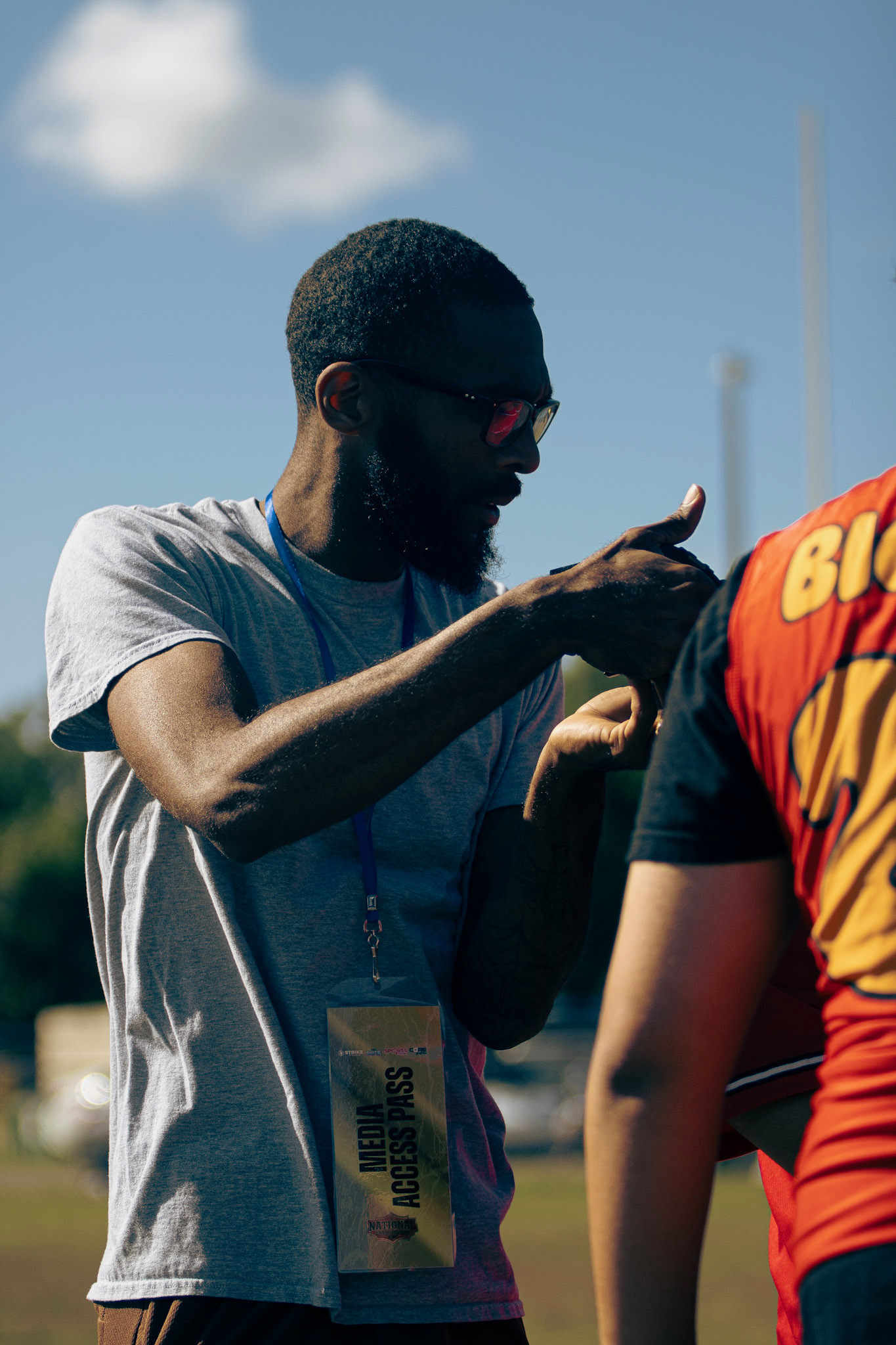 Stick connecting with an athlete while working on the field